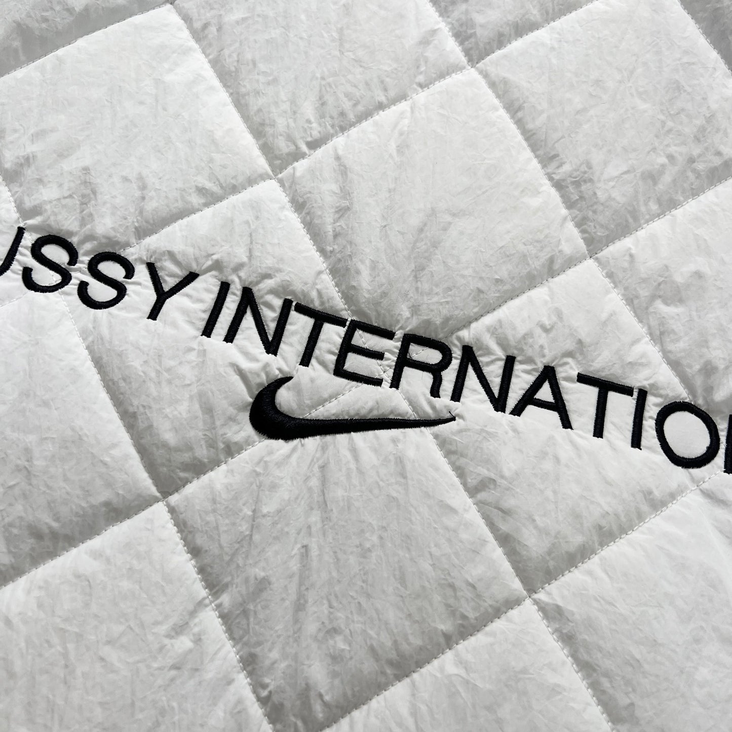 STUSSY x NIKE 聯名雙面穿衍縫鋪棉夾克