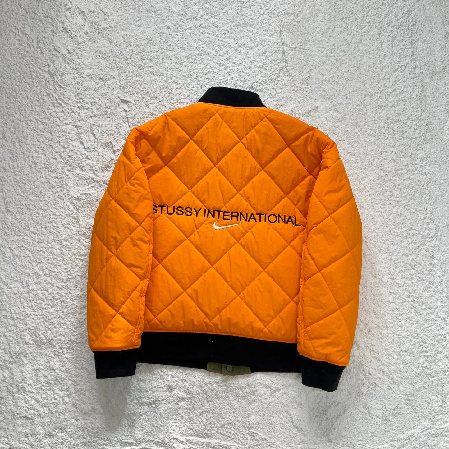 STUSSY x NIKE 聯名雙面穿衍縫鋪棉夾克