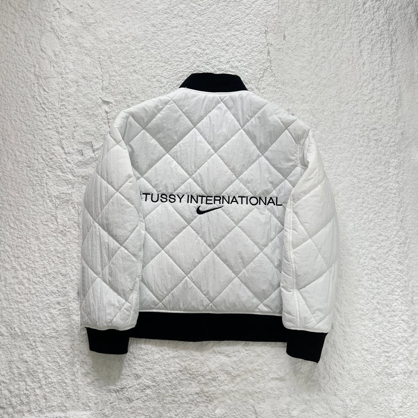 STUSSY x NIKE 聯名雙面穿衍縫鋪棉夾克